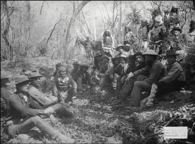 Council between General Crook and Geronimo in Mexico in March, 1886. Lt. Faison is seated far left in foreground.